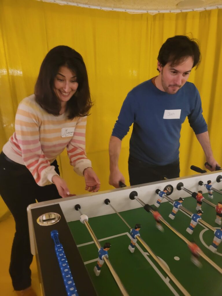 A man and a woman playing table football